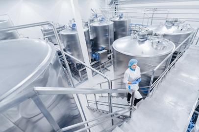 Person walking up stairs in an industrial medical facility