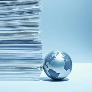 drawing of globe next to a stack of papers