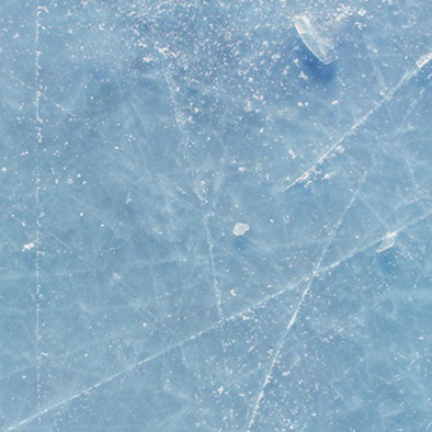 ground with ice and skate tracks across it