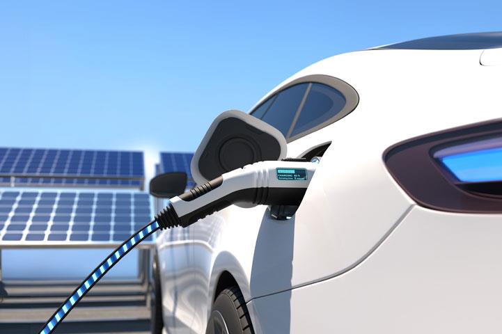 electric vehicle with charging port in use